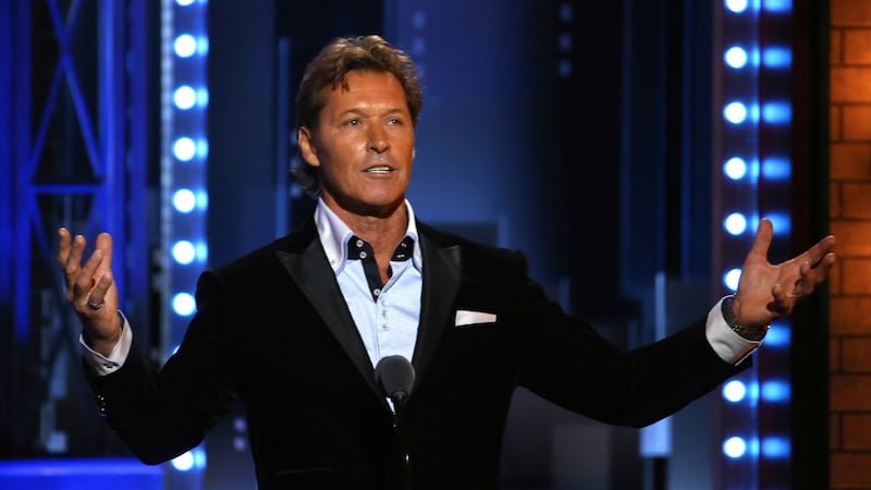 FILE - Former New York Ranger Ron Duguay introduces a performance by the cast of "Come From...