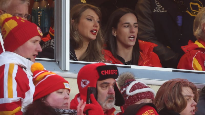 Taylor Swift watches from a suite with basketball player Caitlin Clark, right, during the...