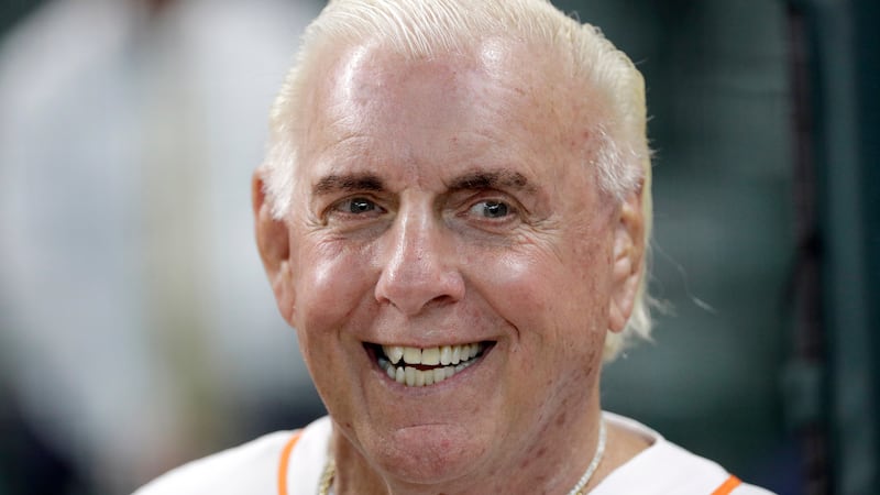 Former professional wrestler Ric Flair waits to throw out the ceremonial first pitch before a...