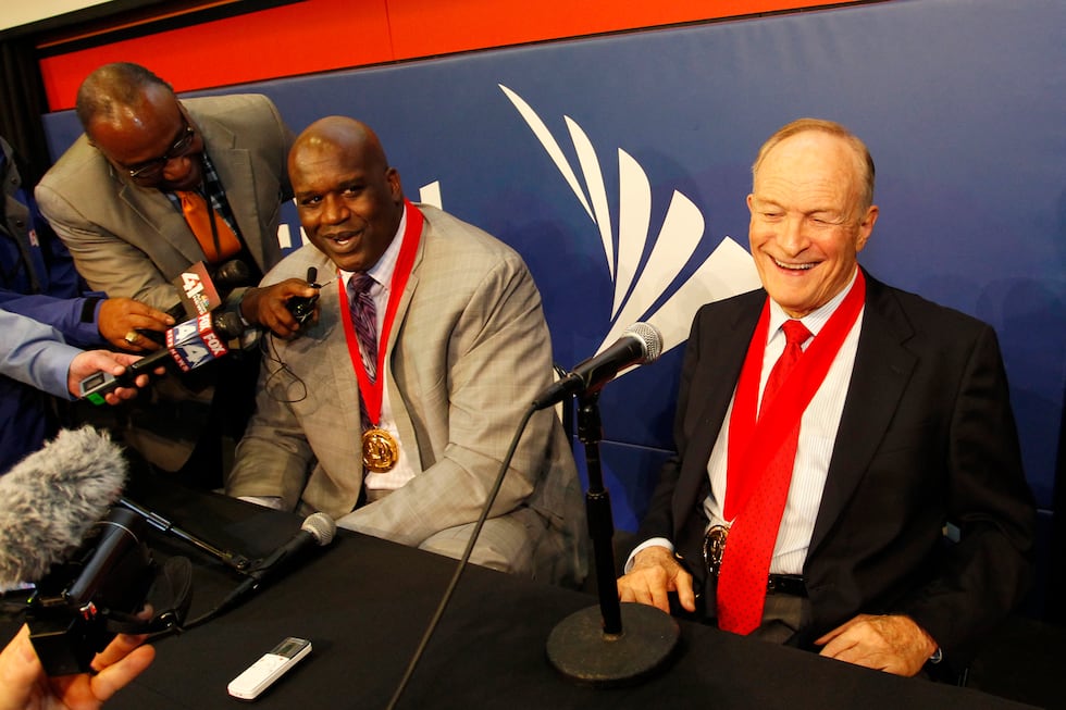 Former Louisiana State player Shaquille O'Neal, left, and LSU coach Dale Brown, right, talk...