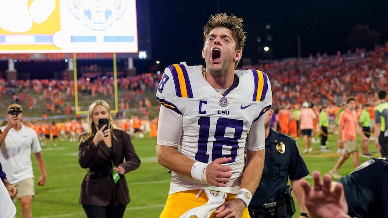 LSU quarterback Garrett Nussmeier (18) reacts after defeating Clemson during an NCAA college...