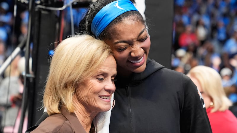 LSU basketball coach Kim Mulkey, hugs Atlanta Dream forward Angel Reese (5) after Game 3 of...