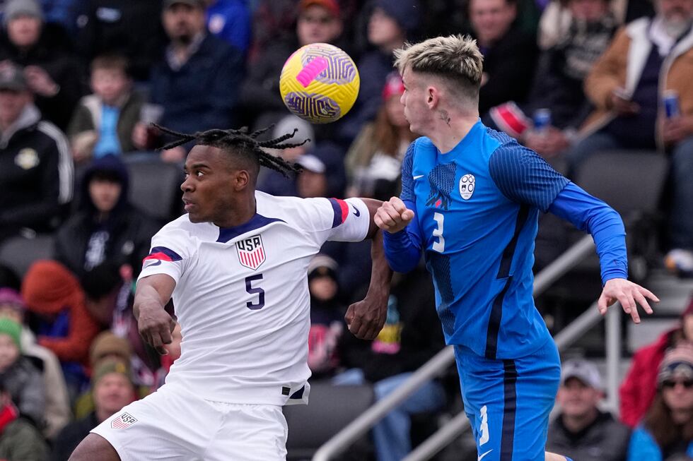 United States defender DeJuan Jones (5) and Slovenia defender Srdan Kuzmic (3) battle for a...