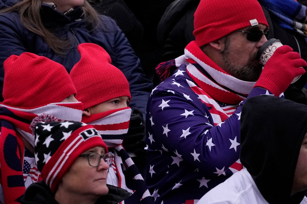 Fans bundle up for the cold during the second half of an international friendly soccer match...