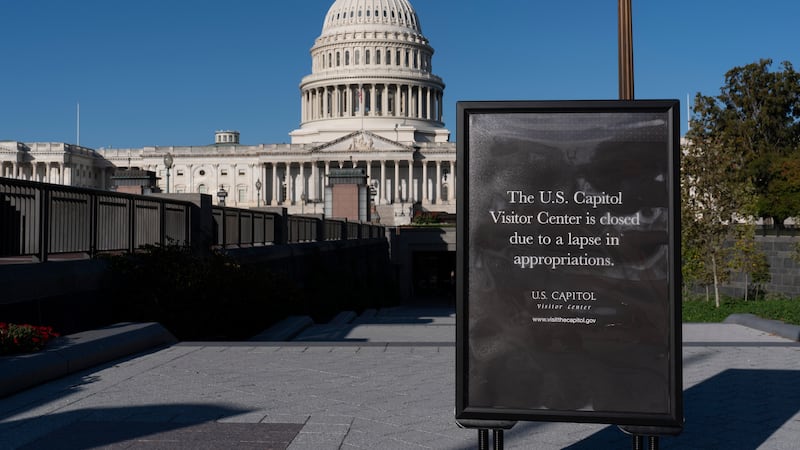 With the government shutdown now in its third week, a sign turns away tourists at the entrance...