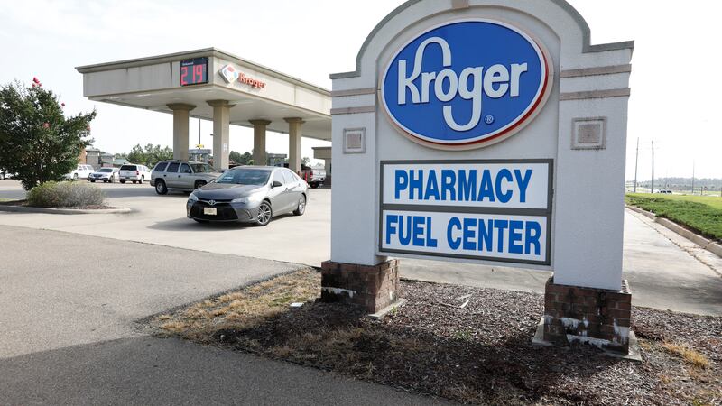 FILE - A customer exits a Kroger fueling center on June 26, 2019 in Flowood, Miss.